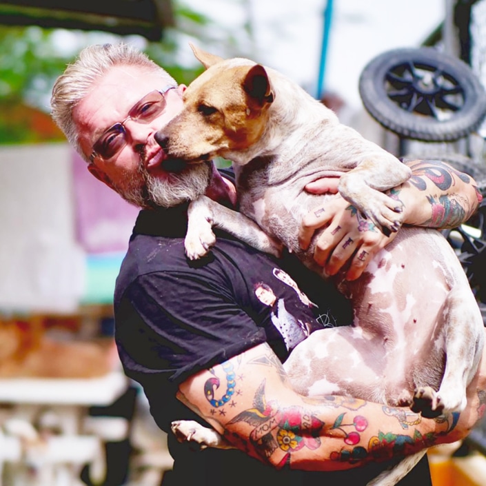 Michael J Baines holding a rescued dog
